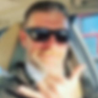 Blurred example profile portrait in sunglasses